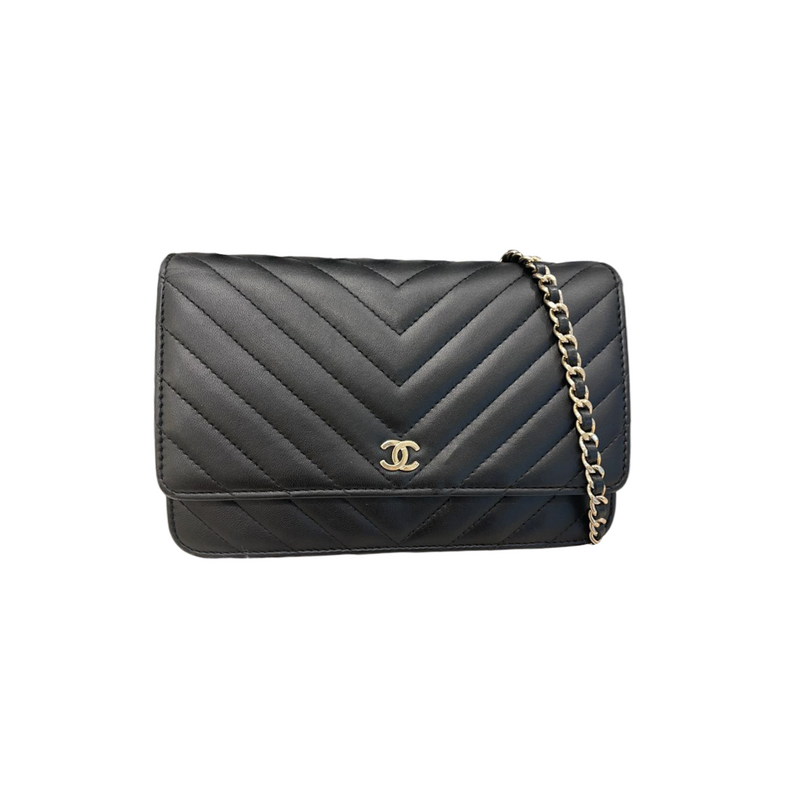 Chanel limited pearls strap WOC in black lambskin with silver hardware.