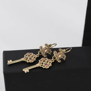 Dangling CC Key Piercing Earrings