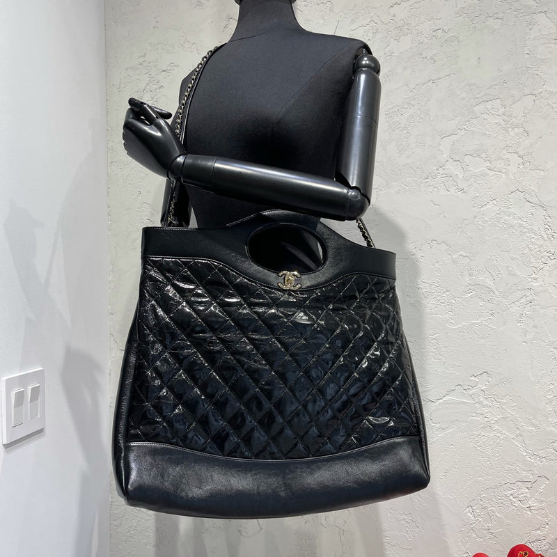 Chanel 31 large shopping bag , Shiny crumpled calfskin & gold-tone metal,  black — Fashion | CHANEL