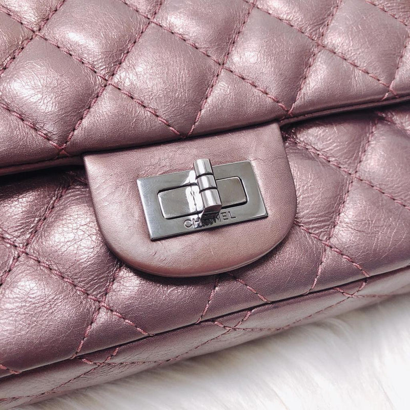 Chanel Reissue maroon calfskin double flap bag with ruthenium hardware.
