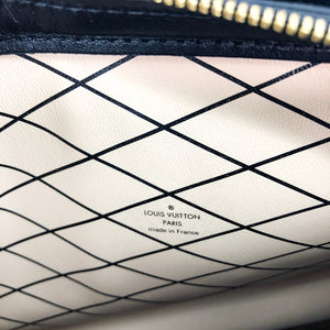 Reverse Monogram Trunk Clutch