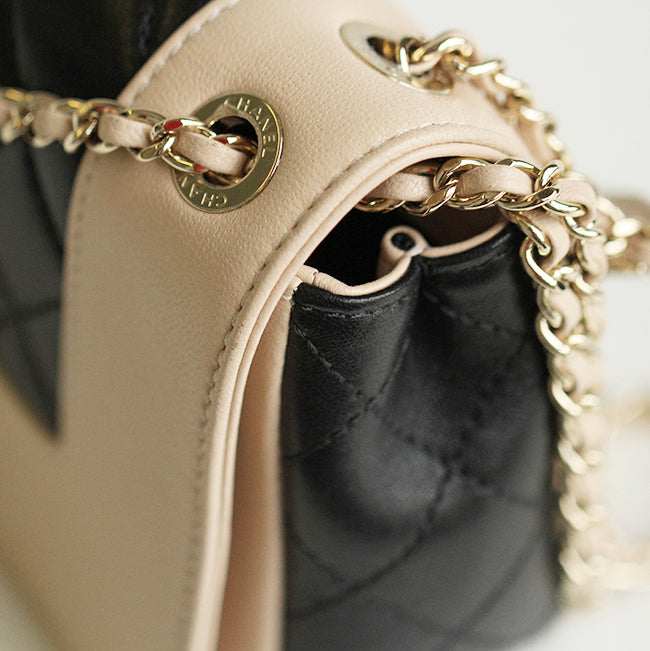 Mademoiselle Vintage Flap Bag in black and beige shiny sheepskin