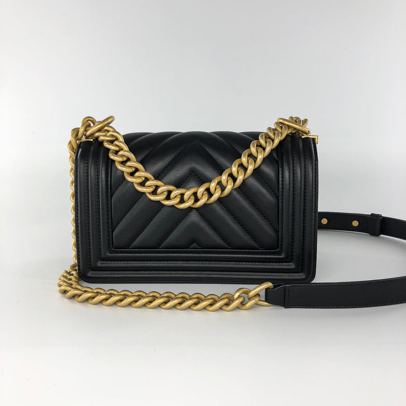 Chanel Small Chevron boy bag in black lambskin leather aged gold