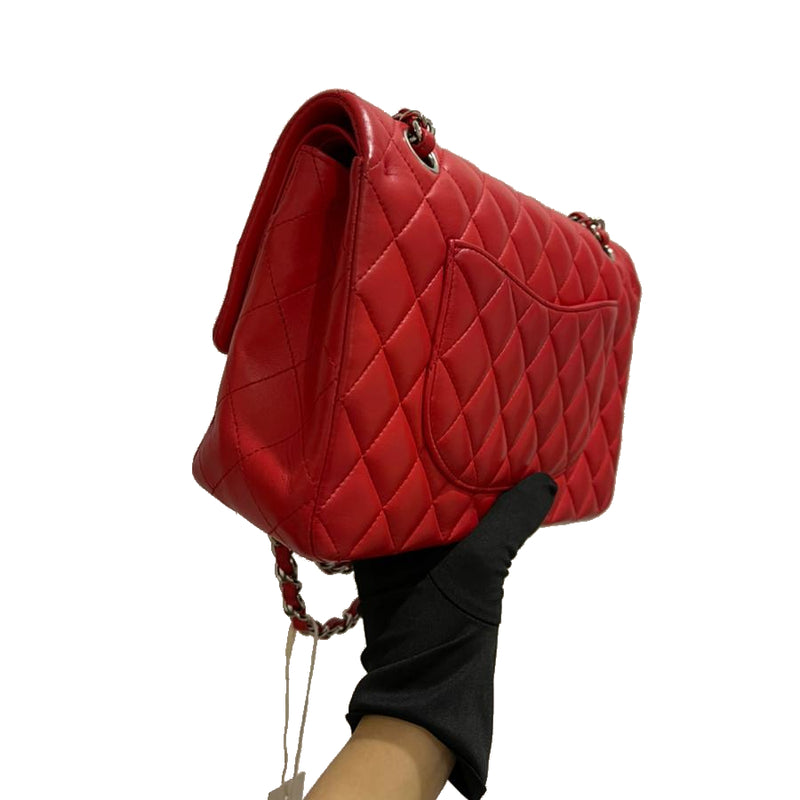 Chanel Red Quilted Lambskin Medium Classic Double Flap Bag – Madison Avenue  Couture